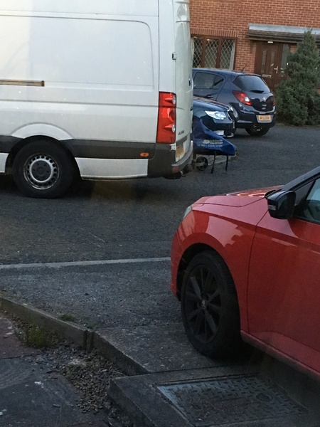 Caravan and van parking in front of my house - AIBU