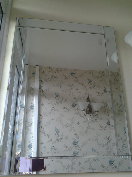 Photo incl - do we want portrait or landscape mirror to make ceiling look higher please?