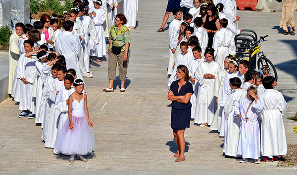 To think that children should west school uniform for their First Holy Communion