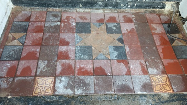 Old tiles (original) on doorstep of London Victorian House- is there anything I can do to restore them?