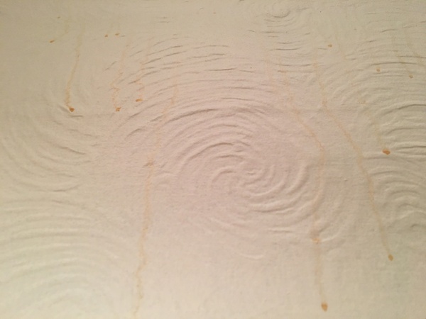 What are these mysterious orange dribbles on freshly painted walls??