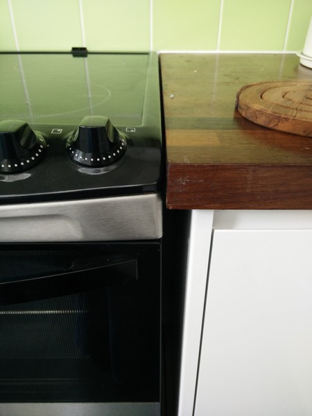 Keeping crumbs from getting between oven and counter