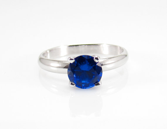 Anyone seen an engagement style ring in SILVER with a blue sapphire or black diamond?
