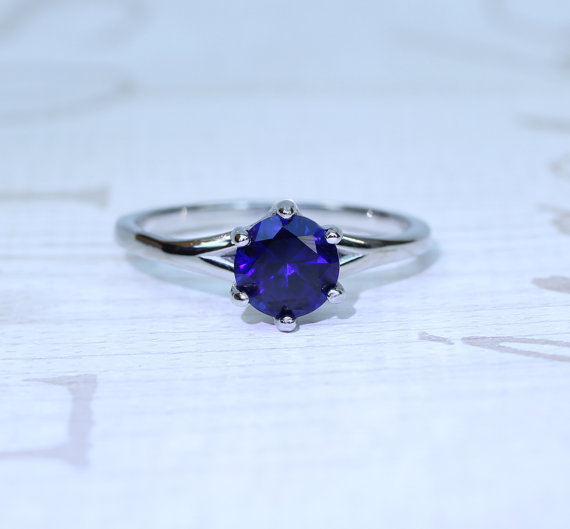 Anyone seen an engagement style ring in SILVER with a blue sapphire or black diamond?
