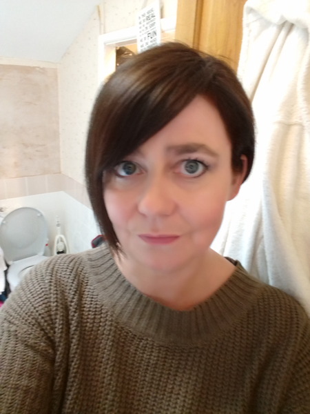Short hair on woman over 40.