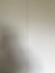 Cracks in cosmetic stud wall.