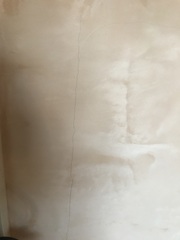Cracks in cosmetic stud wall.