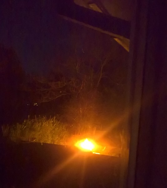 My neighbour has built a bonfire in the garden