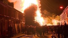My neighbour has built a bonfire in the garden