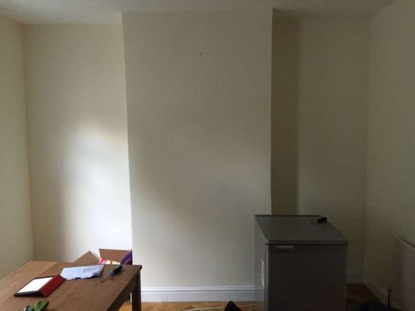 Opening a bricked up fireplace and installing a decorative one - do I need a builder, handyman or a fireplace specialist?