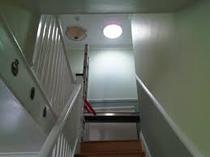 Can you help me with ideas to cheer up a hallway that has little natural light?