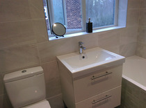 Tiles in bathroom around window