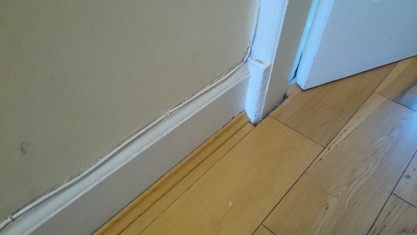 Wooden floor fitted with no expansion gap