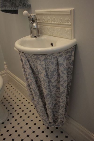 Not happy with new bathroom installation. Plumber left basin pipes exposed....
