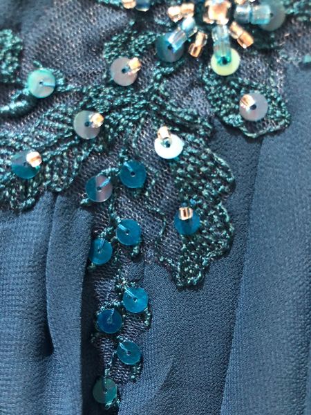 Help! Can this be safely un-tacked? (Pic)