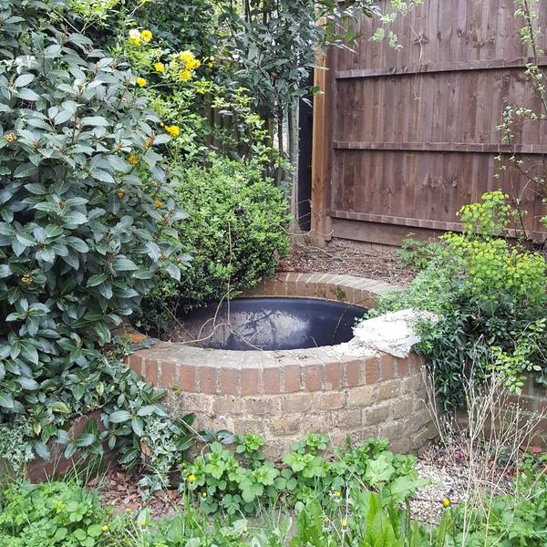 Help me build a platform for my shed in this awkward corner.(pic)