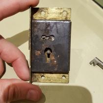Help me unlock this cupboard