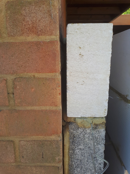 Neighbours extension touching our wall?