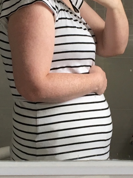 How can I hide this ridiculous first-trimester bump?