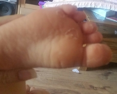 Toddlers peeling feet