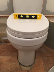 Wonky toilet - can I fix it myself?