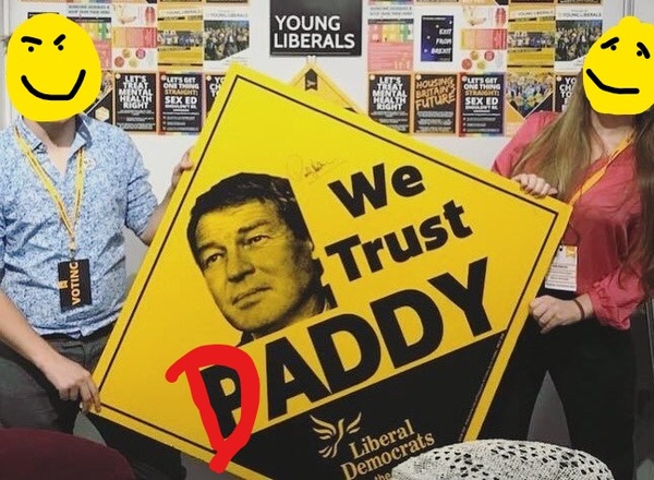 Young Liberals putting women in a bin.