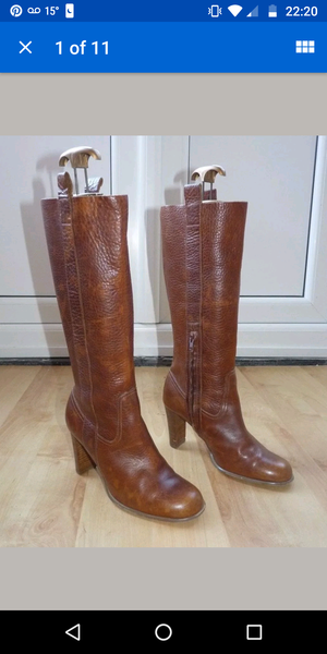 Has anyone seen knee length tan boots with heel, 70s vibe?