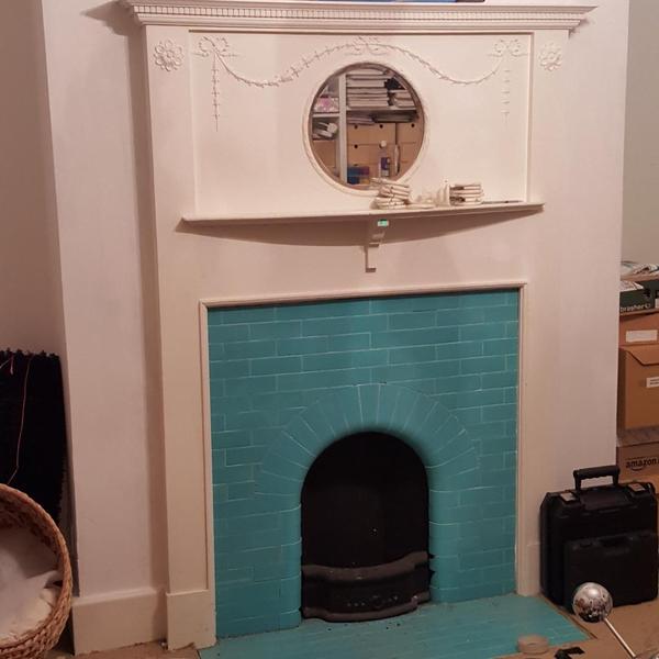 How can I dress this fireplace to make it look really smart?