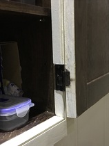 What can I do about these poorly fitted cupboard doors?