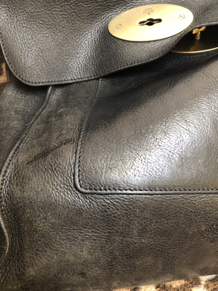 Restoring black leather handbag