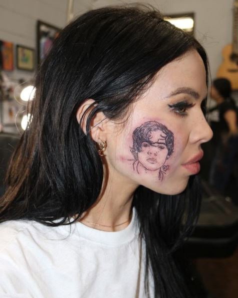 Why would you do this? (face tattoo)