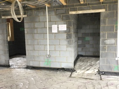 Urgent advice - should I delay screed until plumbers return calls?