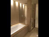Shower enclosure or walk in behind a wall?