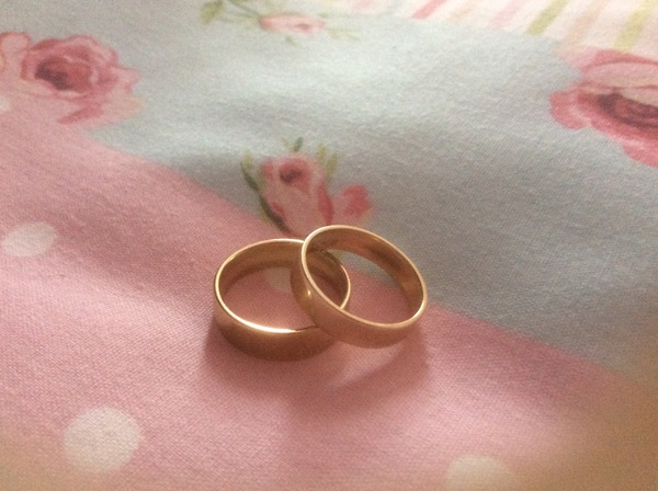 Wide gold wedding bands....