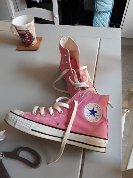 Bright pink converse high tops....