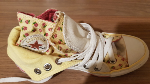 Bright pink converse high tops....
