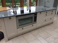 Kitchen island with hob and sink