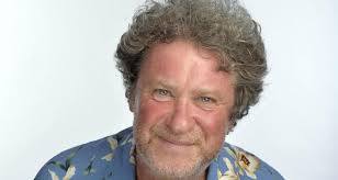 To think there was a blond, curly haired comedian/presenter with a beard...