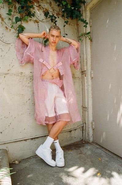 Female = letting out a small shriek because wearing pink
