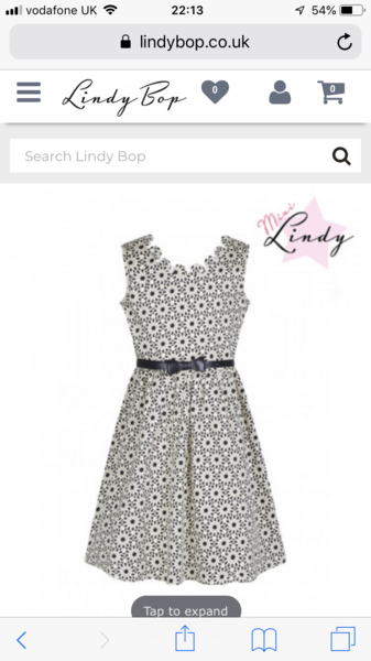 How to dress an eight year old for a wedding? Grown out of 'party dresses'