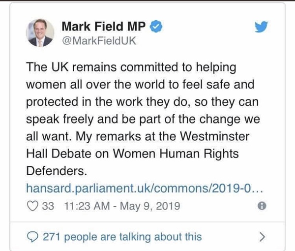 MP Mark Field grabs female protester by throat