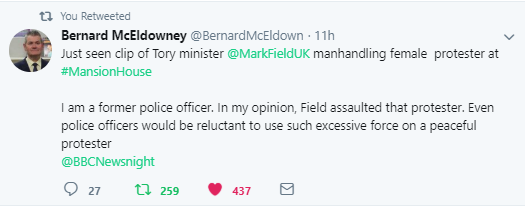 MP Mark Field grabs female protester by throat