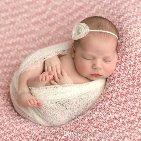 This trend for swaddling your baby until they look like a strange worm for a photoshoot?!
