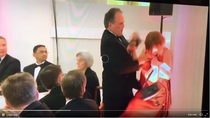 MP Mark Field grabs female protester by throat