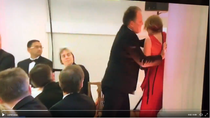 MP Mark Field grabs female protester by throat