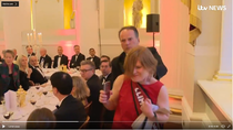MP Mark Field grabs female protester by throat