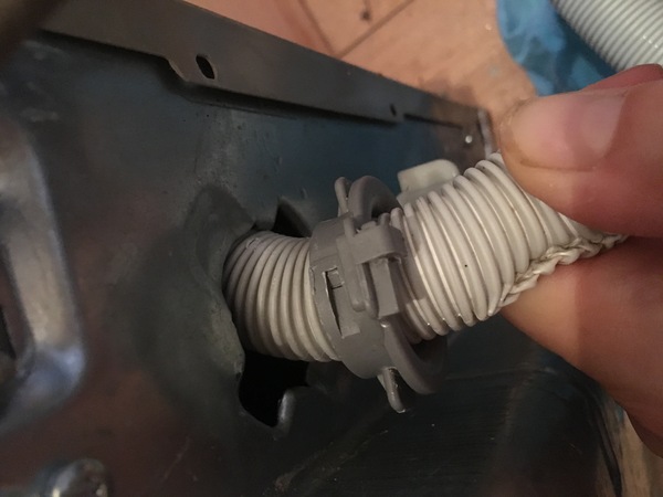 Is it difficult to change a damaged dishwasher hose?