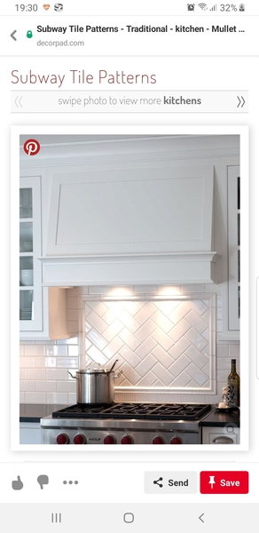Subway tile patterned kitchen splash back