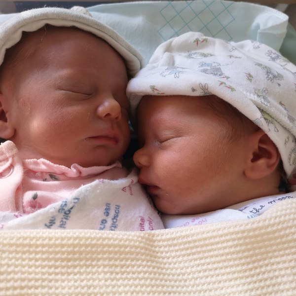 Twins measuring BIG!