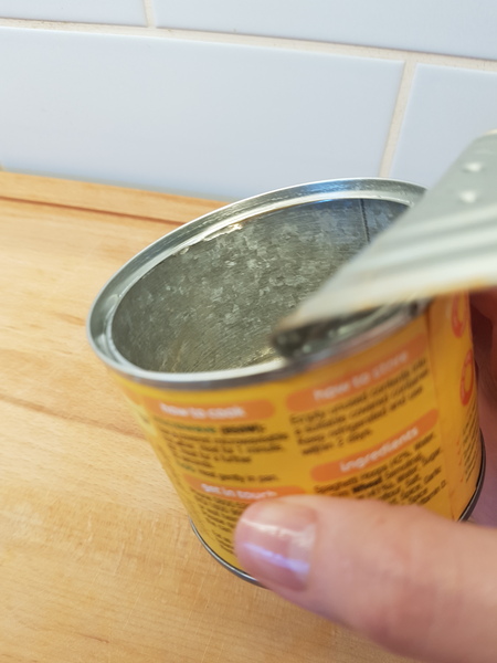 Beans tin black inside, aibu to eat the contents?